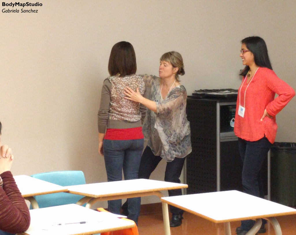 Jennifer Johnson and Gabriela Sanchez help a student to find balance whie standing. 