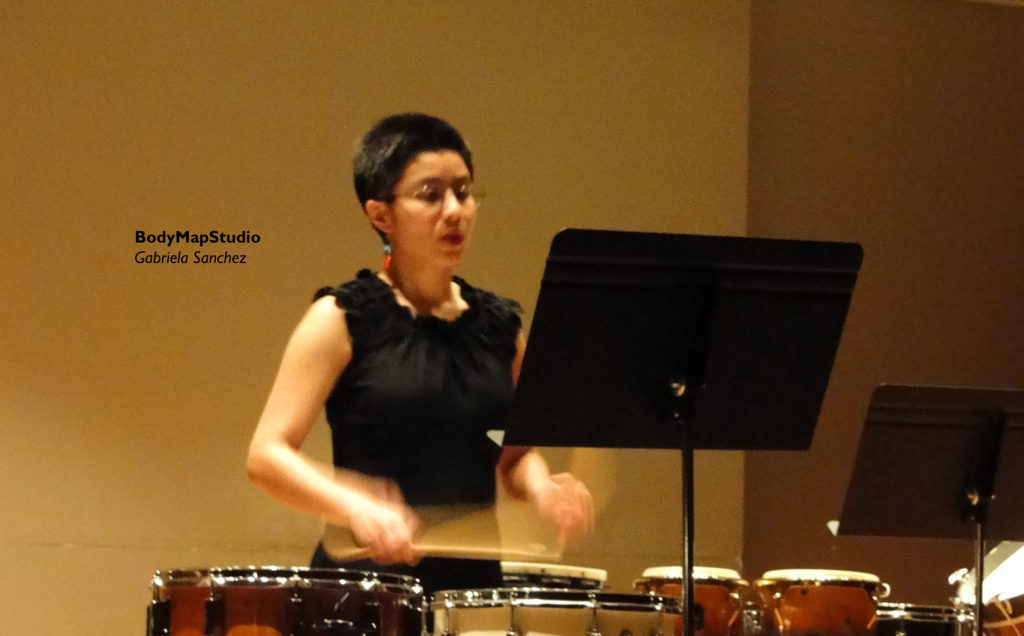 Gabriela playing a snare drum solo. 